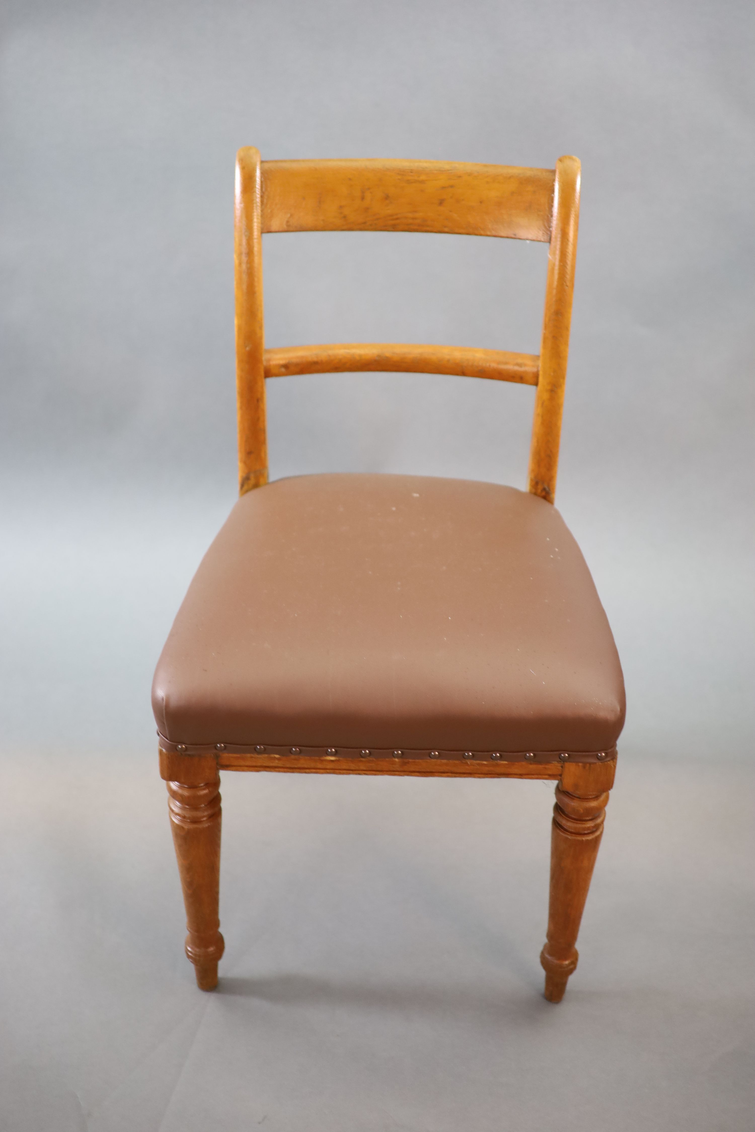 A set of eight early Victorian oak dining chairs